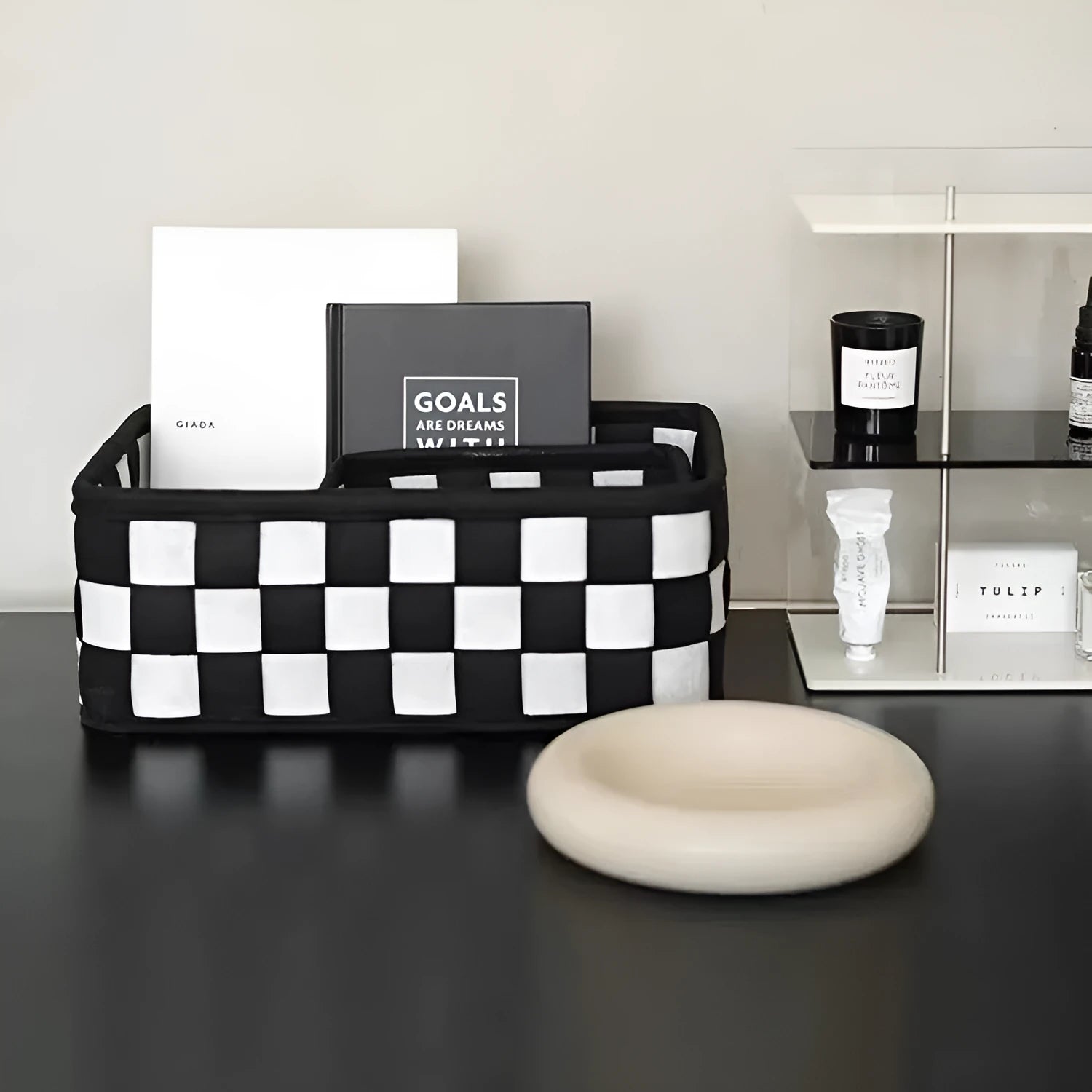 Checkerboard patterned felt folding storage basket showing its size and textured weave.