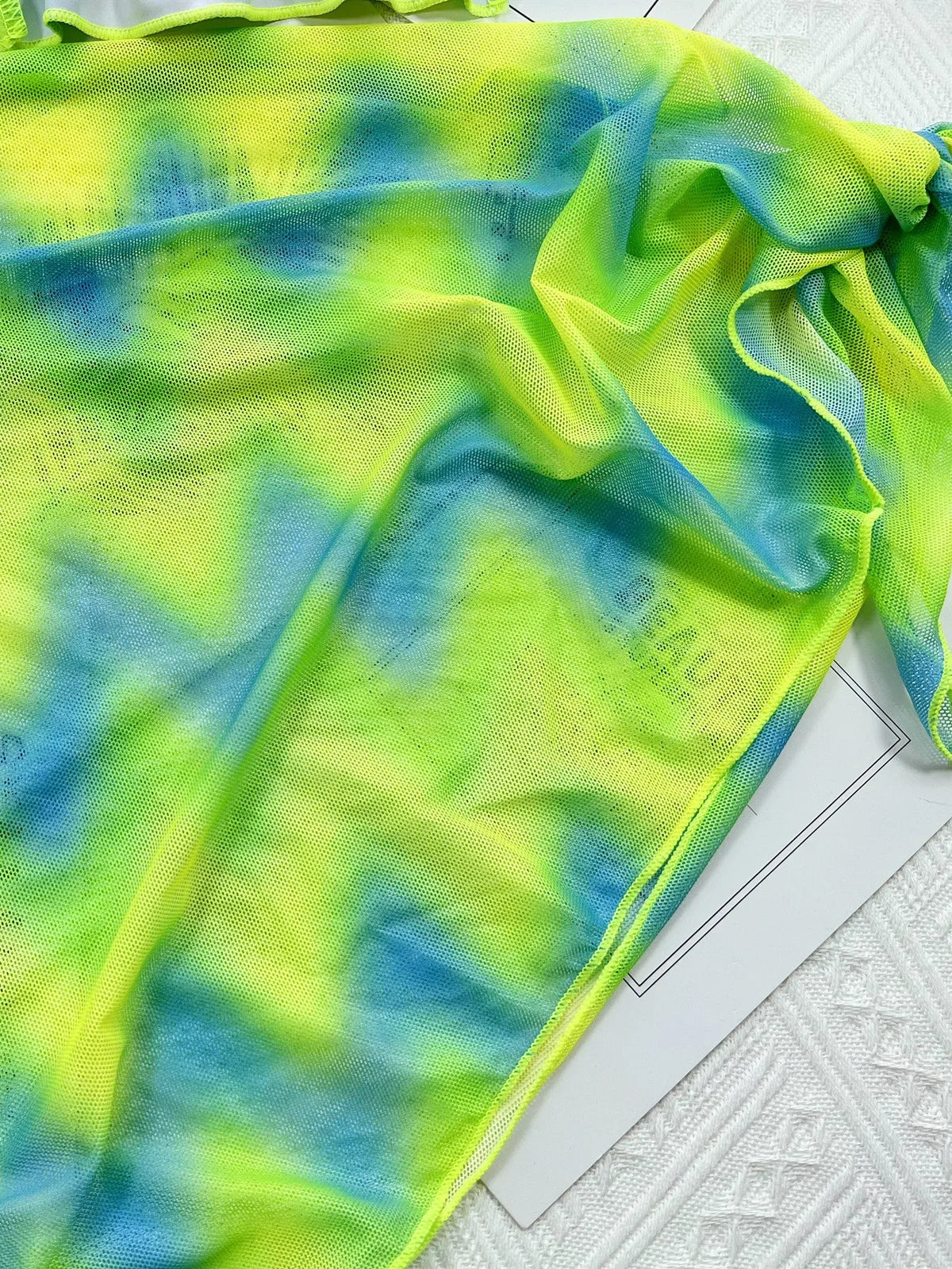 Green tie dyed three-piece bikini set with bra, briefs, and skirt, nylon lining, sizes S M L