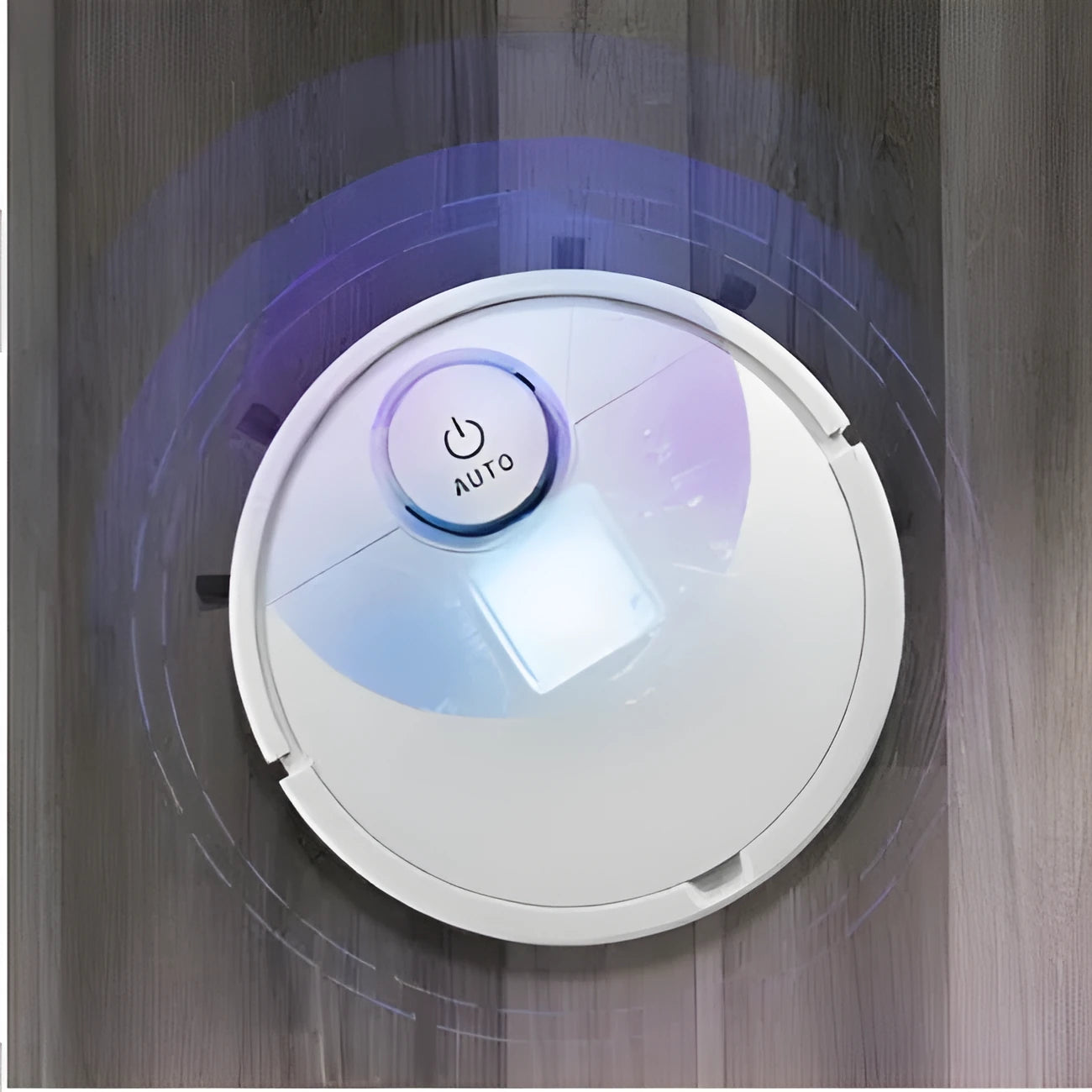 Automatic sweeping robot cleaner with circular ABS plastic body on a hard floor.
