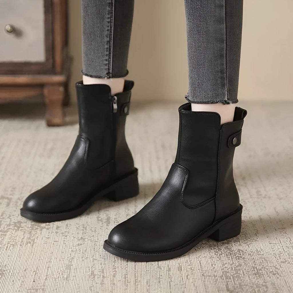 Black women's ankle boots with side zip and low round toe on rubber sole