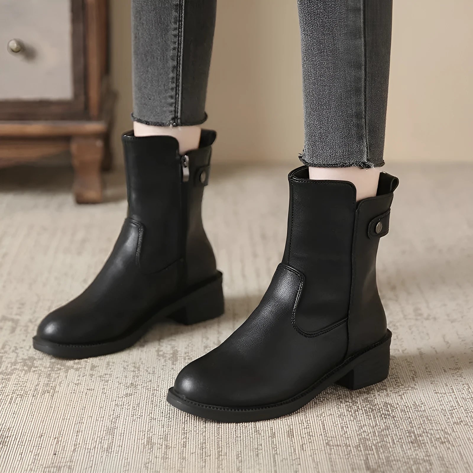 Black women's ankle boots with side zip and low round toe on rubber sole