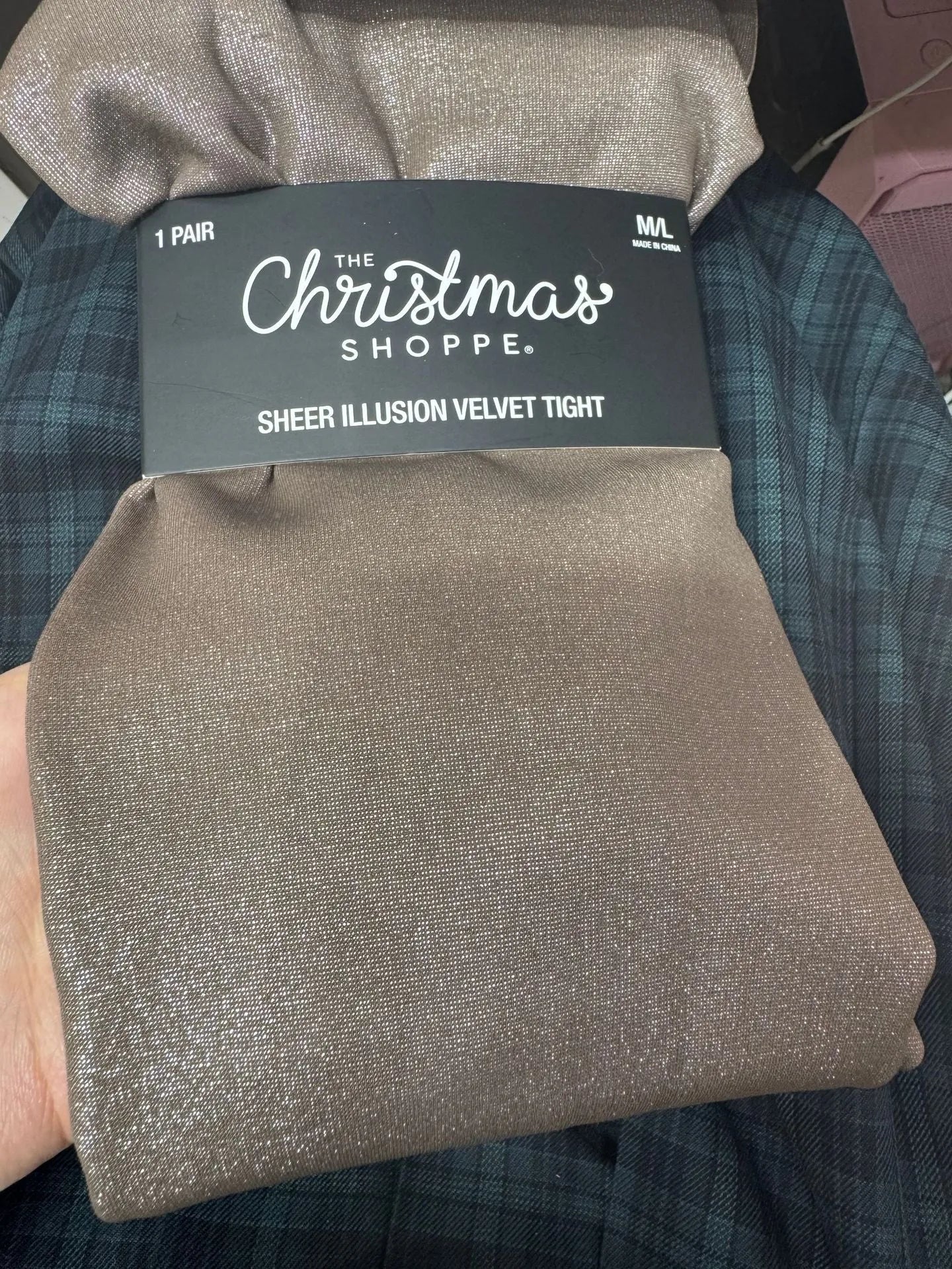 Women's anti-snagging thermal leggings in black and coffee colours showing wool lining and footed style.