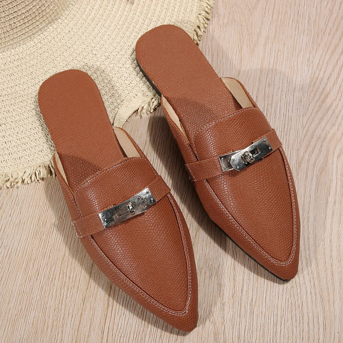 Light brown women's pointed-toe casual semi-slippers with a low heel and rubber sole.