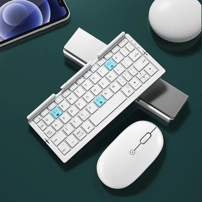 Silver white folding Bluetooth keyboard with stand holding smartphone