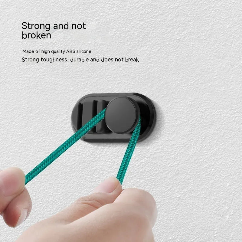 Car data cable storage hook in dark green with adhesive mount for vehicle organisation