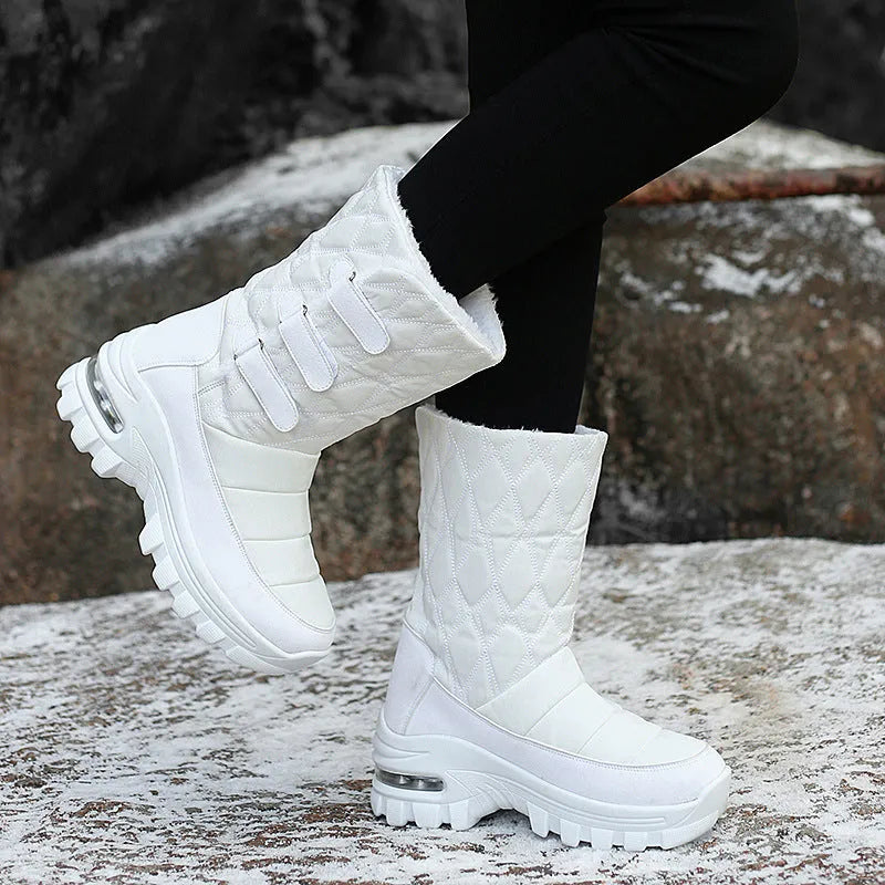 Women's high top snow boots in black with faux fur lining, 5cm heel, Velcro fastening, and PU air cushion sole.