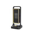 Black compact PTC ceramic air heater with control knob, shown with EU, UK, and US plug options.