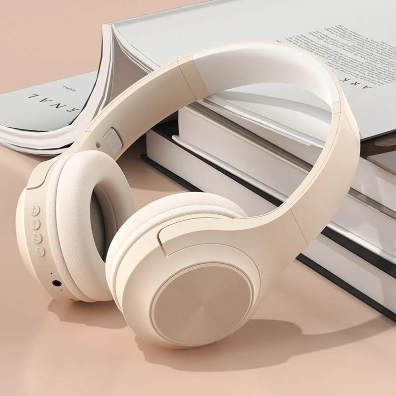 A creative head-mounted wireless Bluetooth headset in youth green colour with its matching charging case.