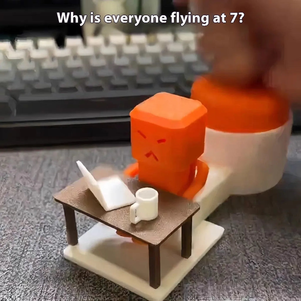 Orange plastic vent decompression artefact, a table turning fidget toy measuring 16x6x7 cm.