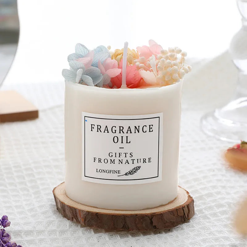 Decorative dried flower scented candle with choice of nine aromas on a wooden chip base.