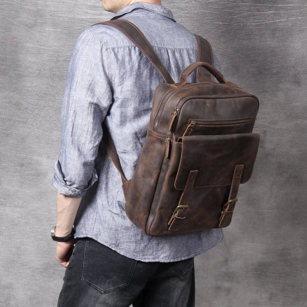 Dark coffee coloured handmade leather backpack with internal organiser compartments.