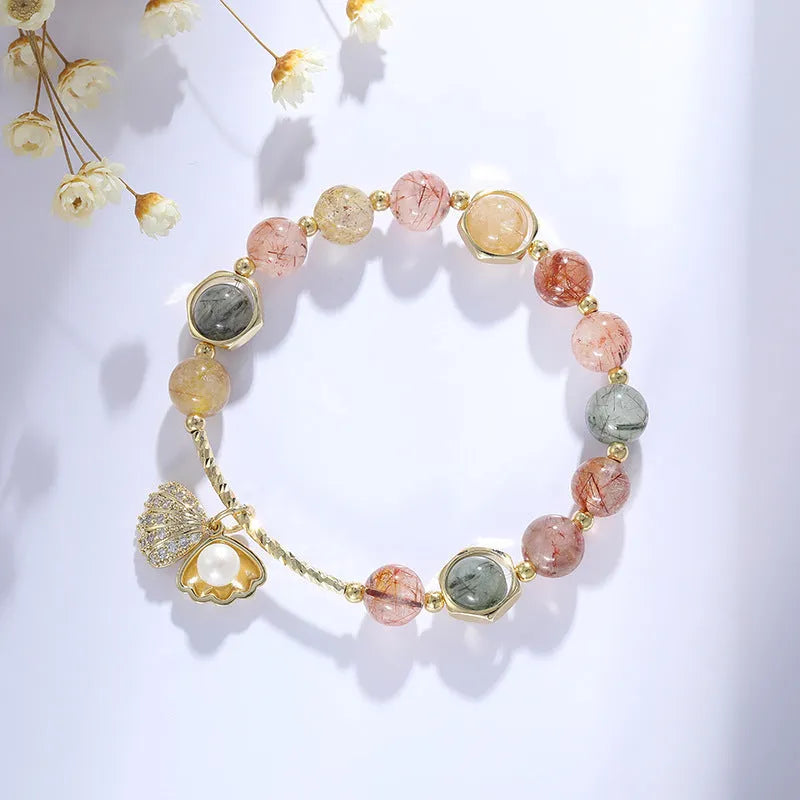 Women's crystal bracelet with coloured hair crystal shells and animal zodiac designs