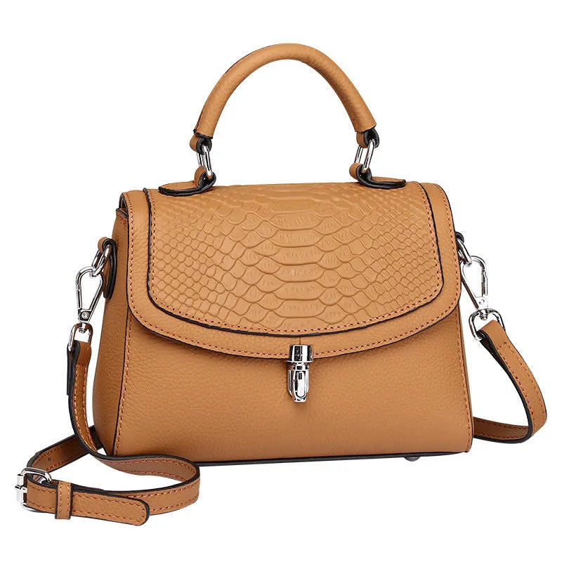 Real leather cross-body bag in head layer cowhide with crocodile print, small square shape, lock opening, blue or brown.