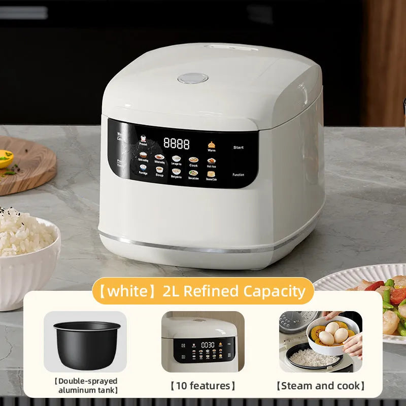 White 2L smart rice cooker with black microcrystal panel and PP steamer on kitchen counter