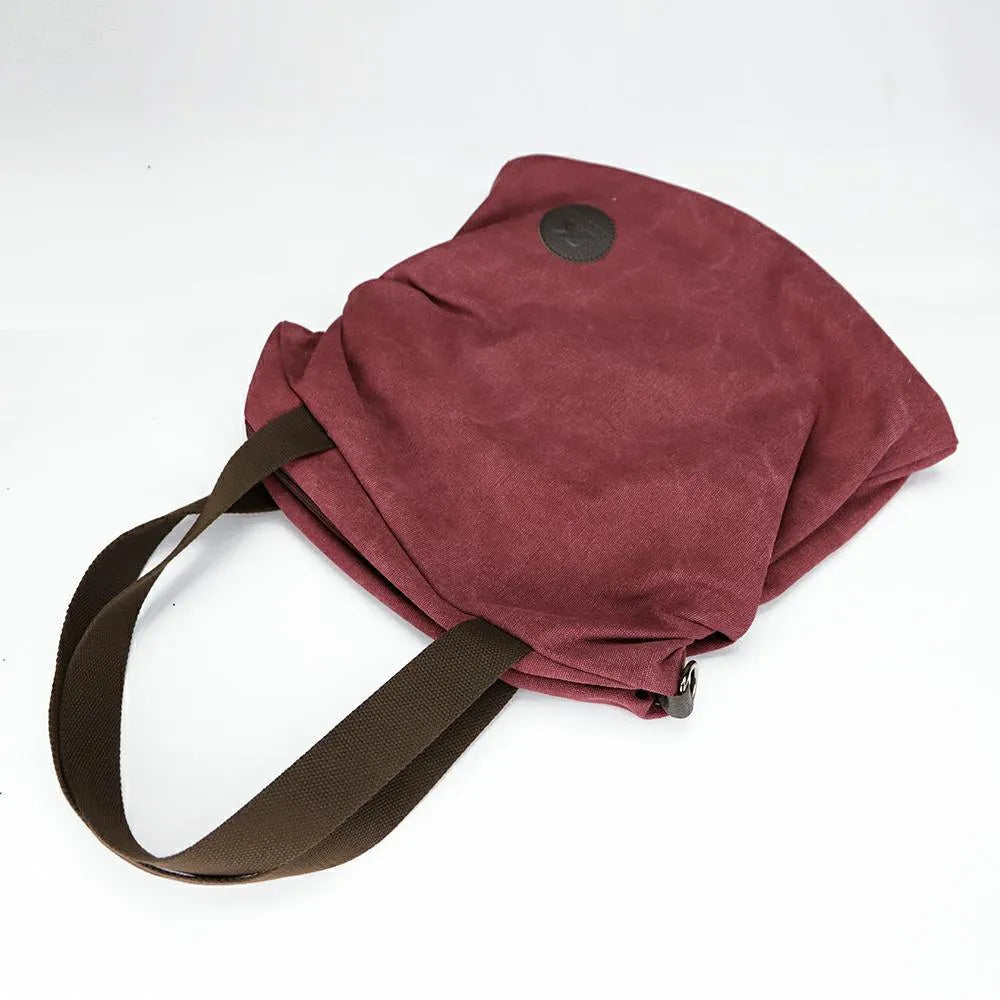 Korean casual canvas bag with square vertical shape, texture canvas, car suture detail, and plain pattern in blue.