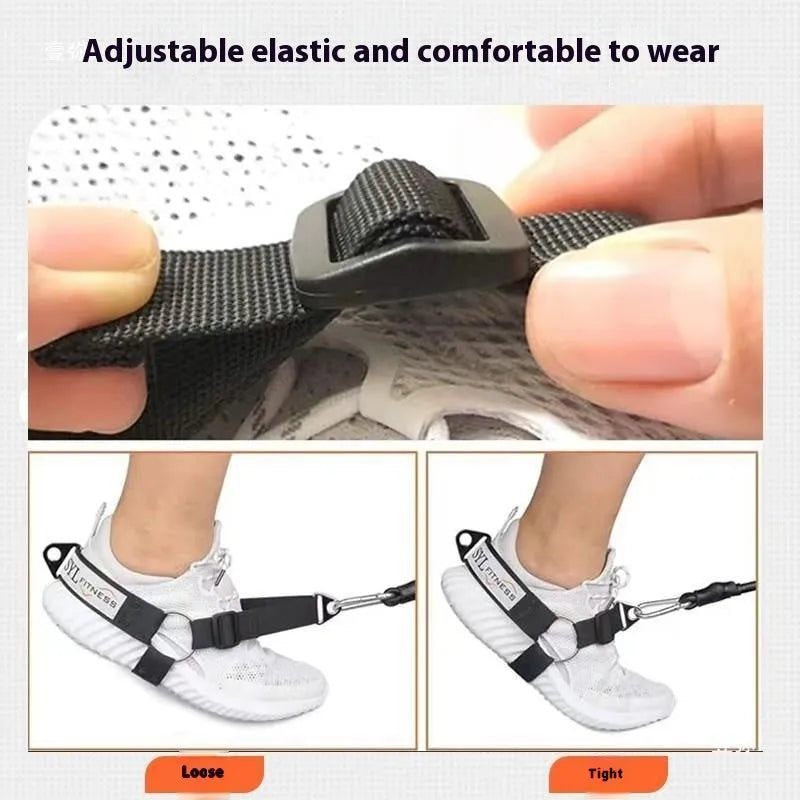 Close-up of a black rope access leg strap bootie showing the adjustable ankle buckle, tension strap, and attached foot lanyard.