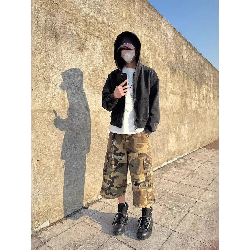 Men's retro patch ripped camouflage cropped jeans showing distressed detailing and straight leg design