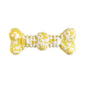 Green and white camouflage patterned natural rubber dog chew toy for large breeds on a wooden floor.