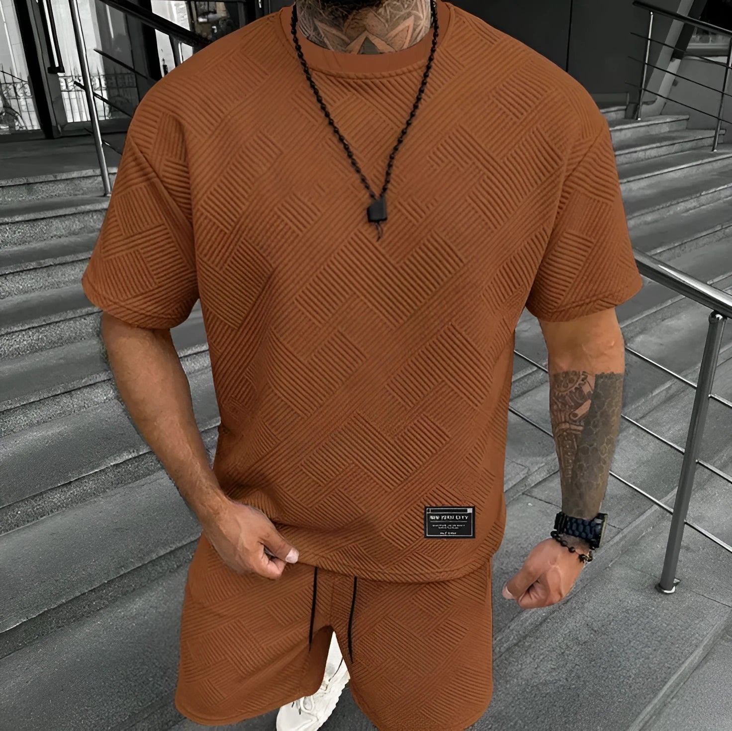 Men's short sleeve top and shorts suit with 3D printed pattern for sport and leisure wear.