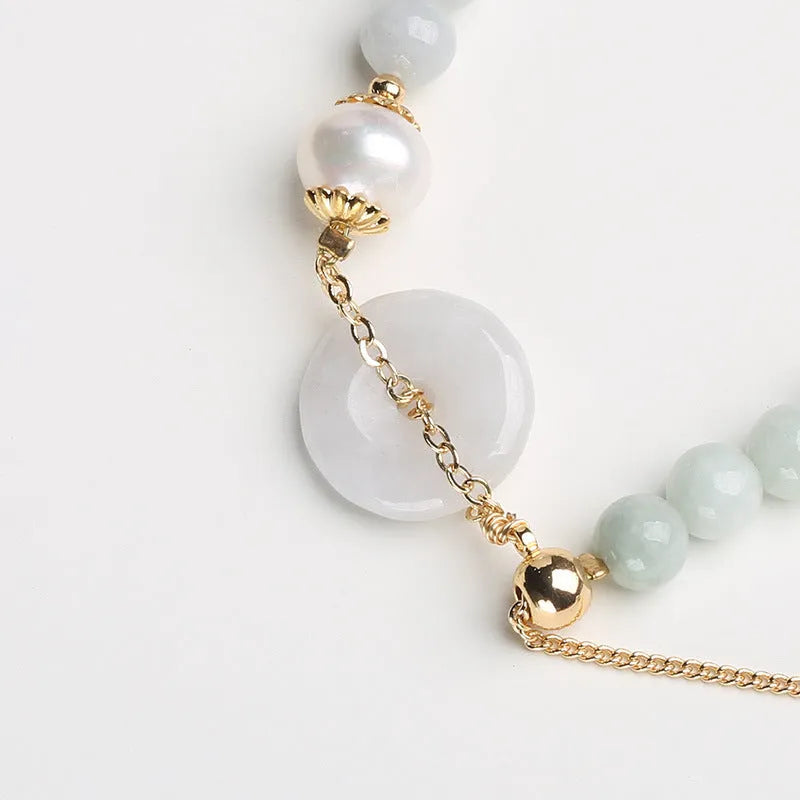 Jade green pearl bracelet with peace buckle fastening and round geometric pendant for women