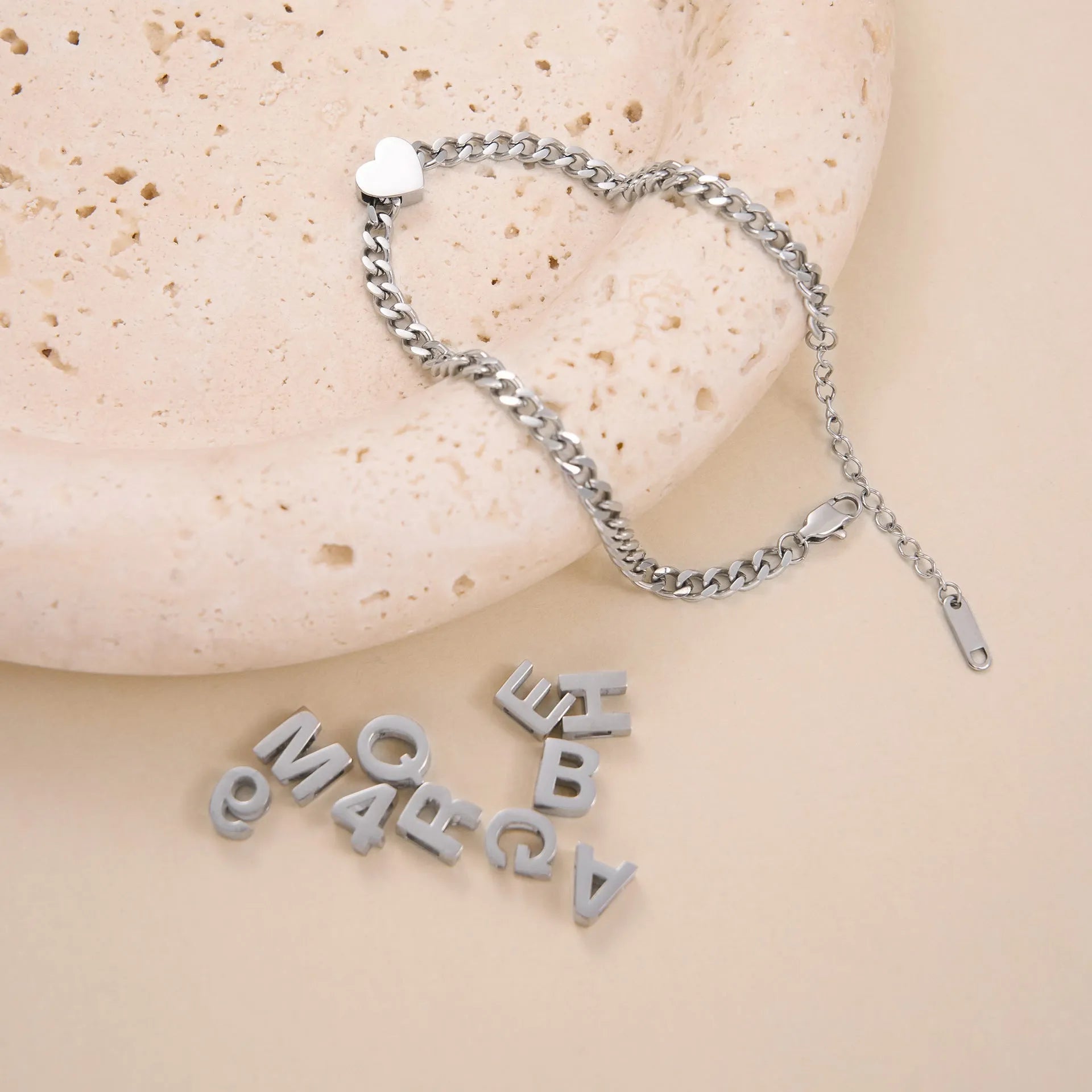 Titanium steel necklace with a personalised letter charm on a 40.5cm gold electroplated chain.