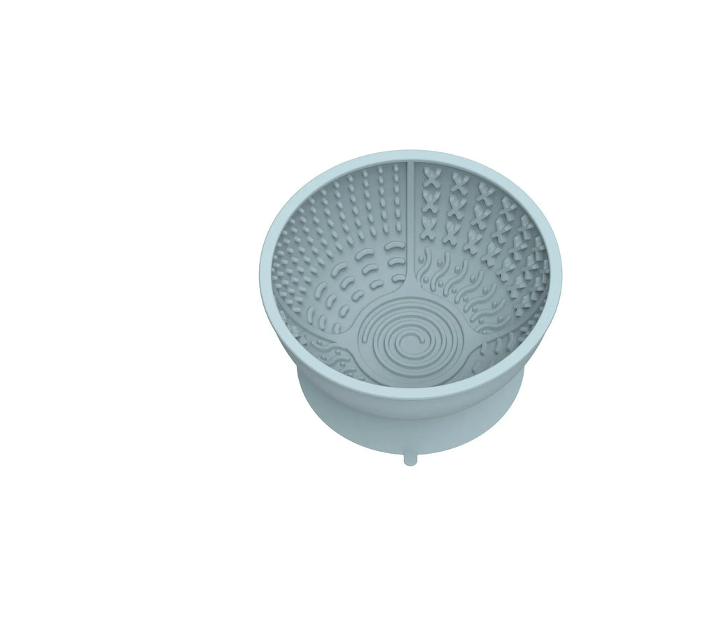 Cyan silicone pet bowl with textured licking mat pattern and suction cup base