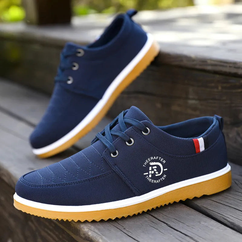 Men's black canvas platform casual work shoes with leather toe cap and textured sewing line detail.