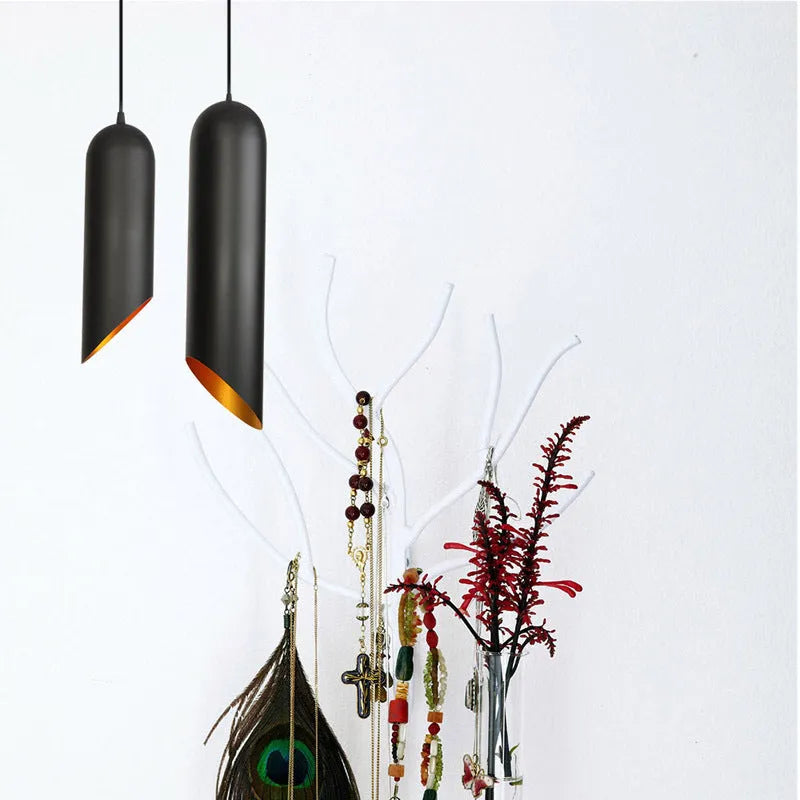 Retro geometric iron chandelier in matte black finish with multiple arms, hanging from a ceiling.