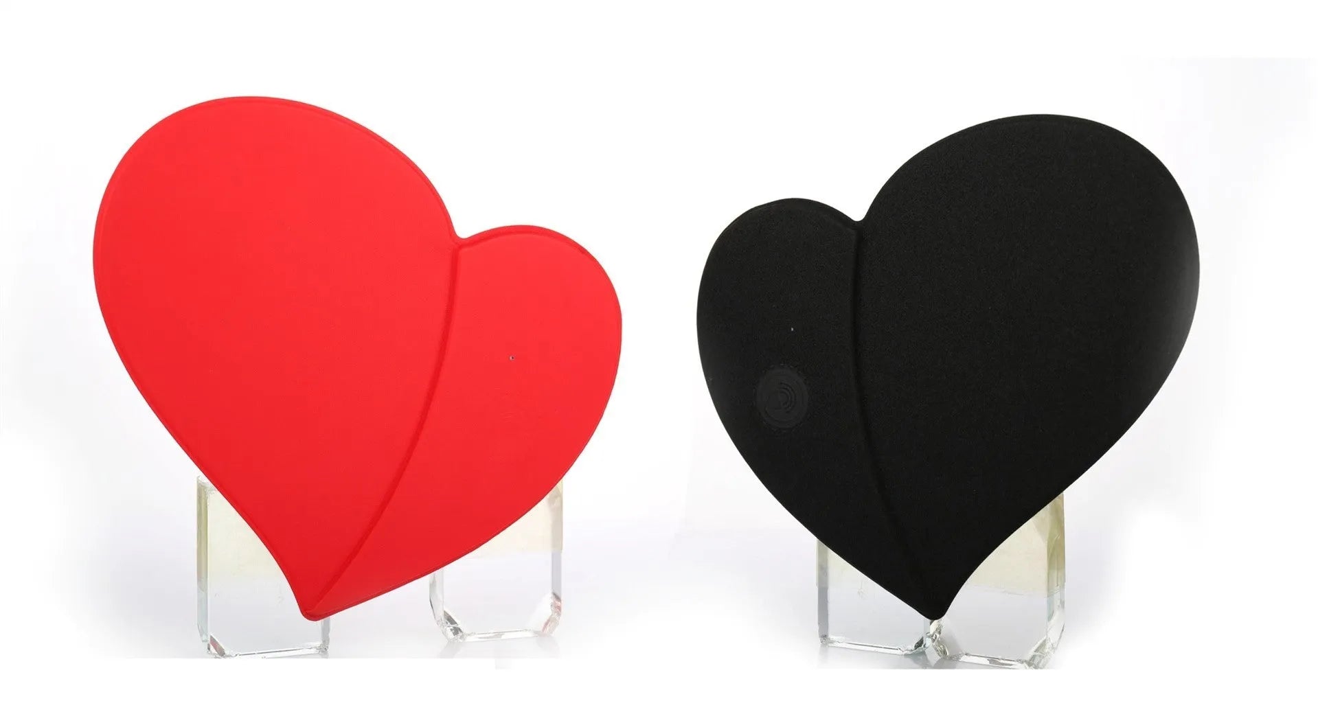 Heart shaped red leather wireless charging mouse pad with indicator light on a desk