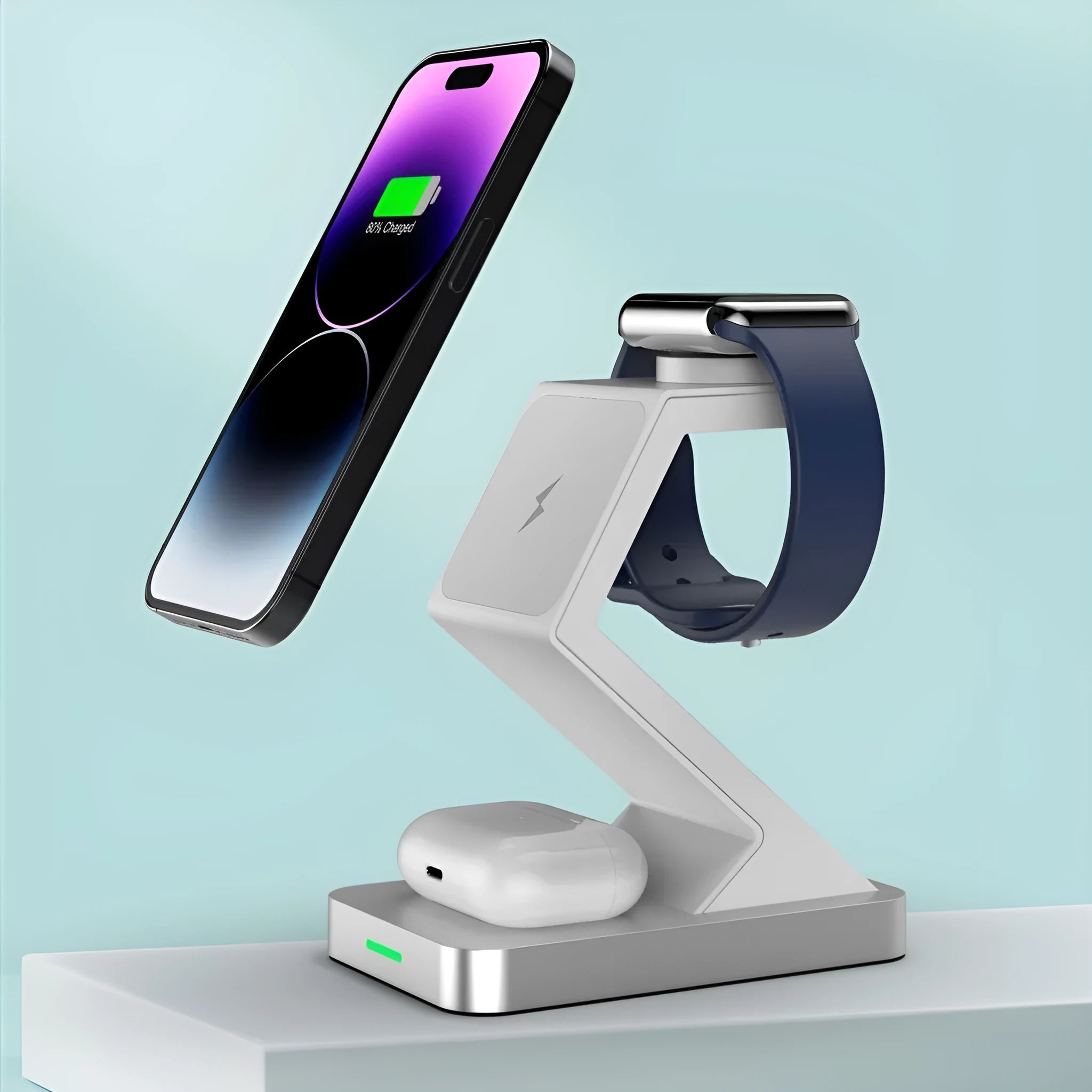 Three-in-one magnetic wireless charger phone holder in black with phone, watch and earbuds on a desktop