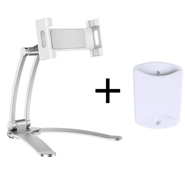 Silver aluminium desktop tablet stand holding a tablet, showing 360-degree rotation and dual adjustable clip design.