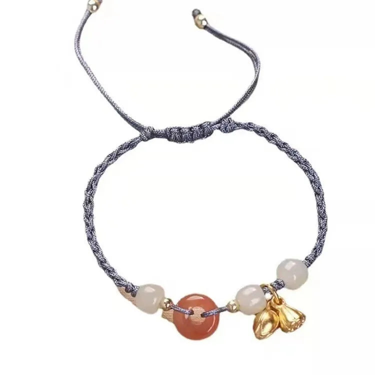Women's Hetian jade bracelet with peace buckle charm, constellation detailing, and adjustable shihuan closures