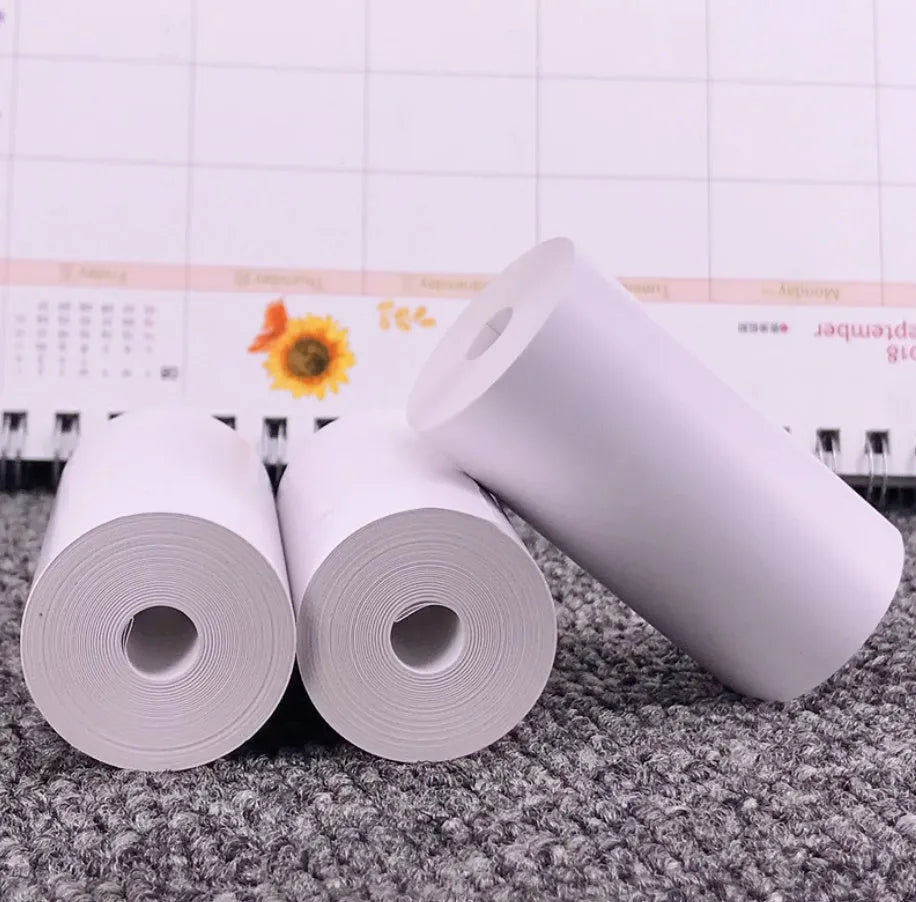 PerPage mini thermal printer paper rolls in regular, sticker, and label types with blue, pink, white, violet, and yellow options