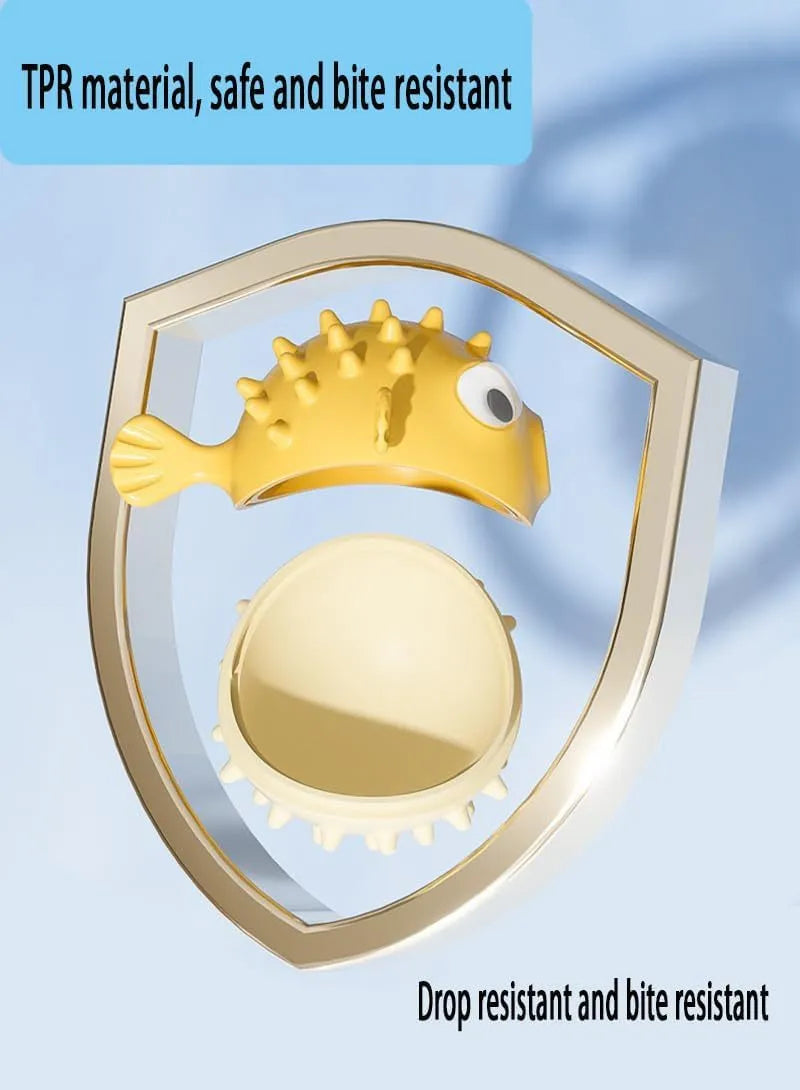 Green fish-shaped interactive dog toy with treat hole and textured surface, shown next to dog treats.