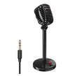 Black USB computer microphone with adjustable neck stand on desktop