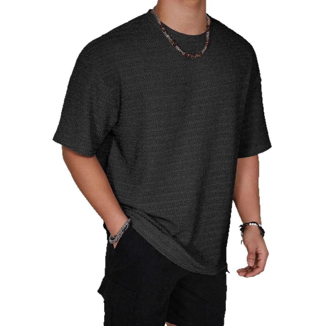 Men's slim fit short sleeve polyester t-shirt in light blue colour on a hanger