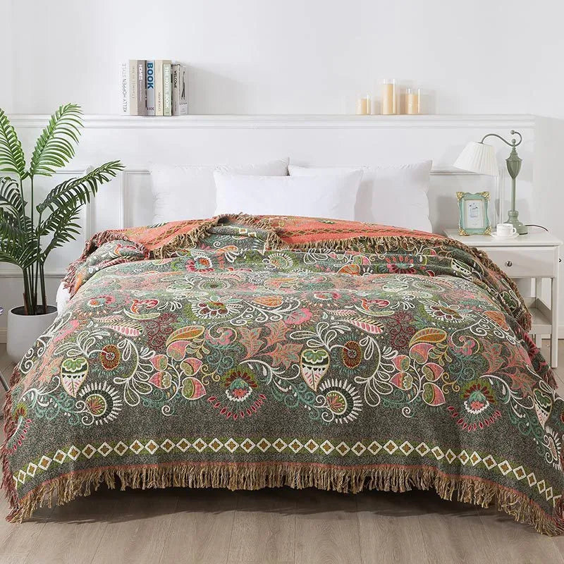 Cotton gauze towel blanket with tassel edging in neoclassical floral pattern, available in 150x200cm and 200x230cm.
