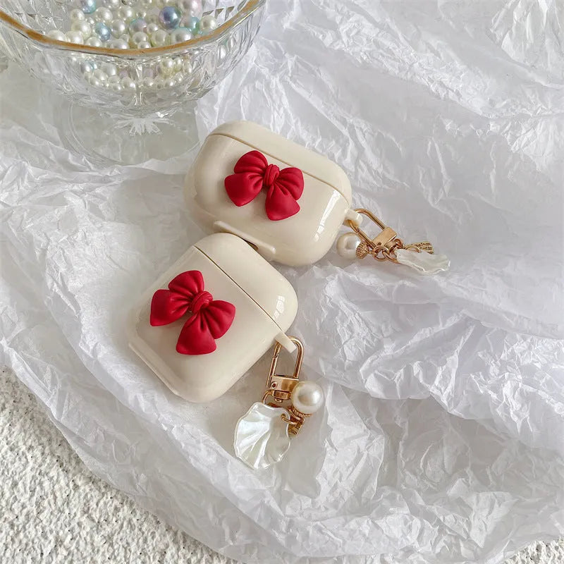 Beige red bow shell TPU clamshell case for AirPods Pro, AirPods 3, AirPods 1 and AirPods 2 wireless earphones