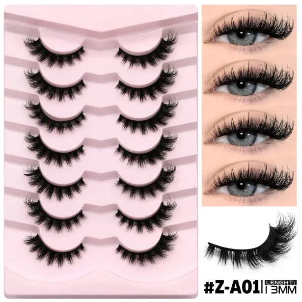 Box of black artificial fibre false eyelashes in a natural thick style with a tube of adhesive glue.
