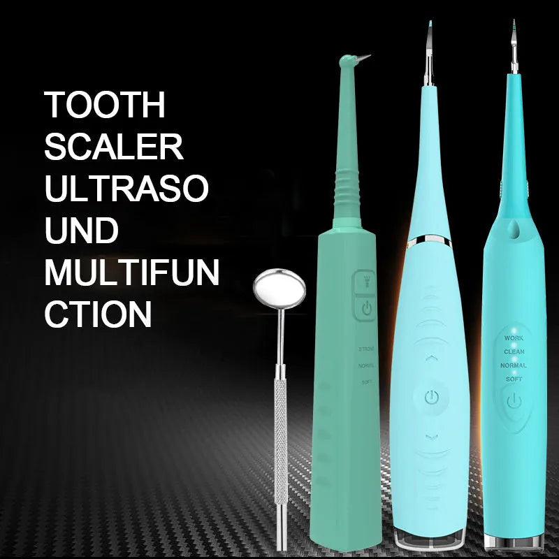 Pink and blue waterproof electric dental scaler tool on a bathroom counter with charging cable.