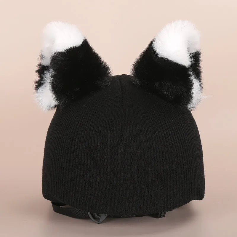 Soft plush cartoon character cover stretched over a pair of black on-ear headphones.