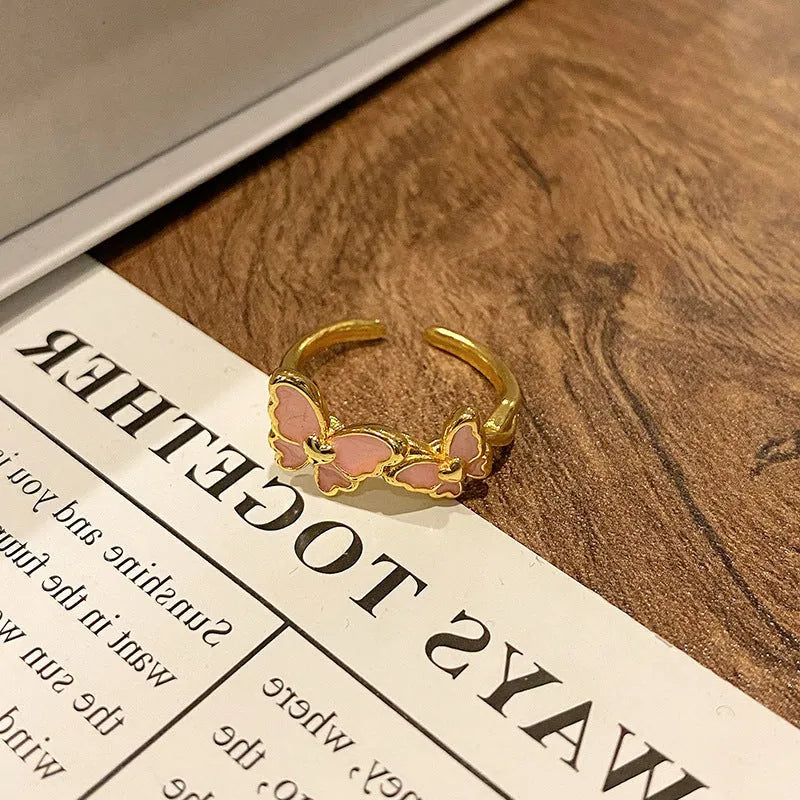 Copper women's ring with Chinese butterfly design and oil-drip finish in simple jewellery style