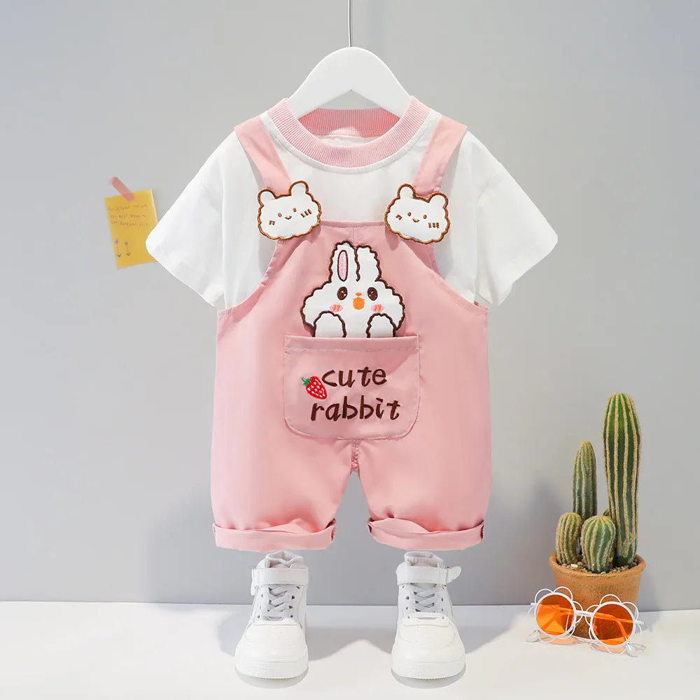 Yellow children's cotton short-sleeved romper with cartoon print and adjustable straps.