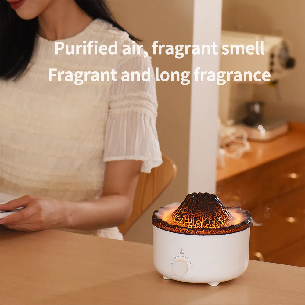 White simulated flame volcano humidifier and aroma diffuser with remote control on wooden surface