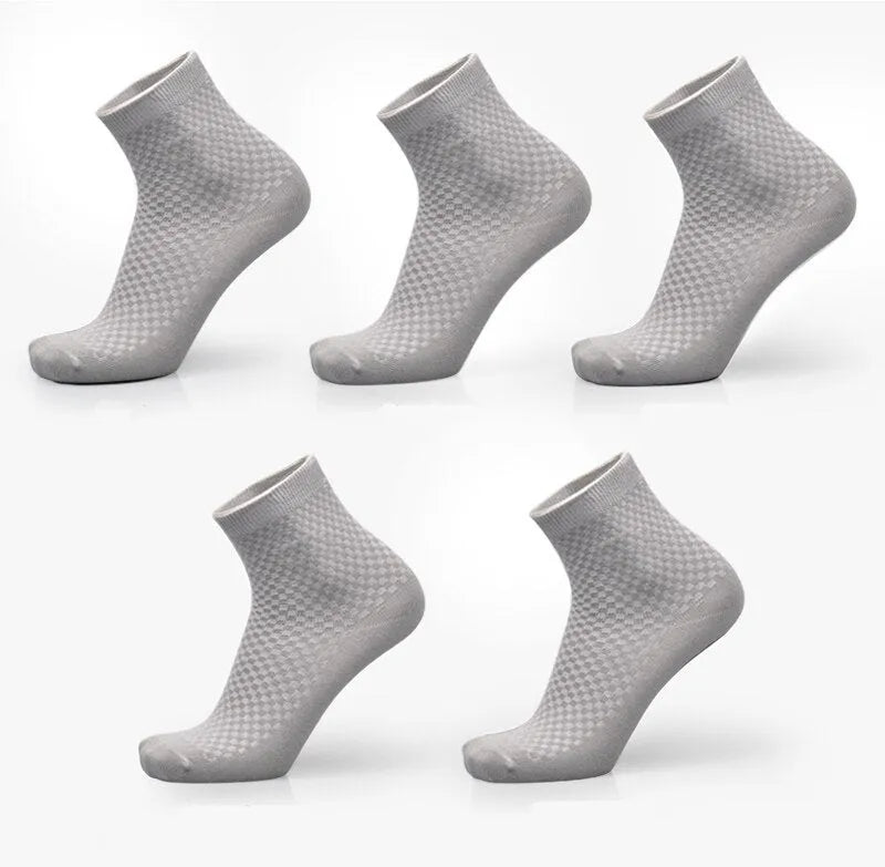 Men's bamboo fibre socks in black, navy, silver, iron grey, and grey blue with small square pattern.
