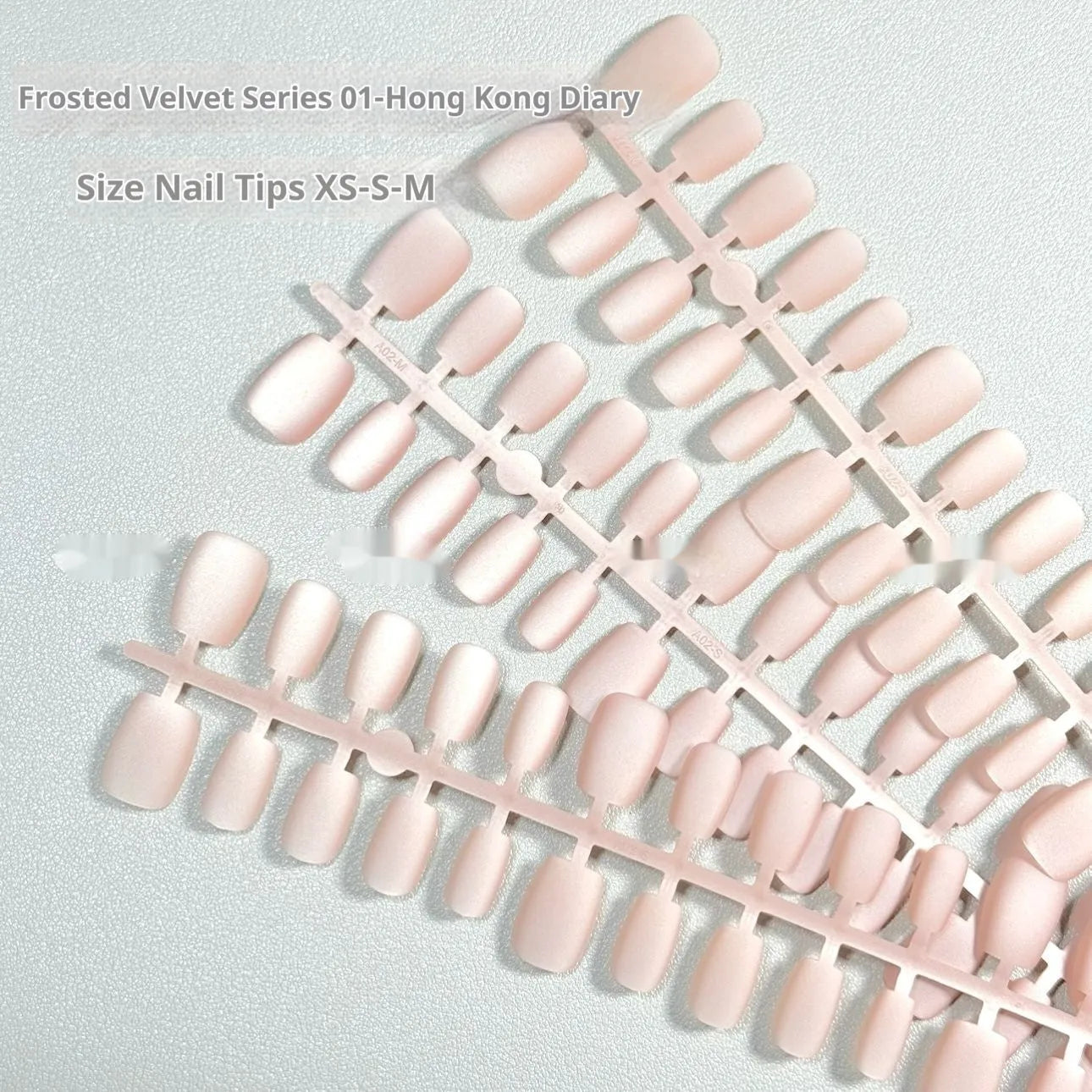 Frosted Velvet Cat's Eye press-on nails in short ladder sizes, showing solid colour and aurora designs.