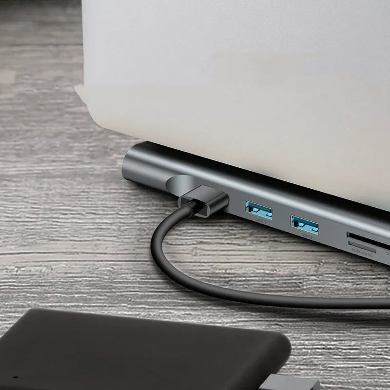 Space grey aluminium alloy ten-in-one USB-C hub adapter with HDMI VGA RJ45 USB 3.0 SD audio and charging ports