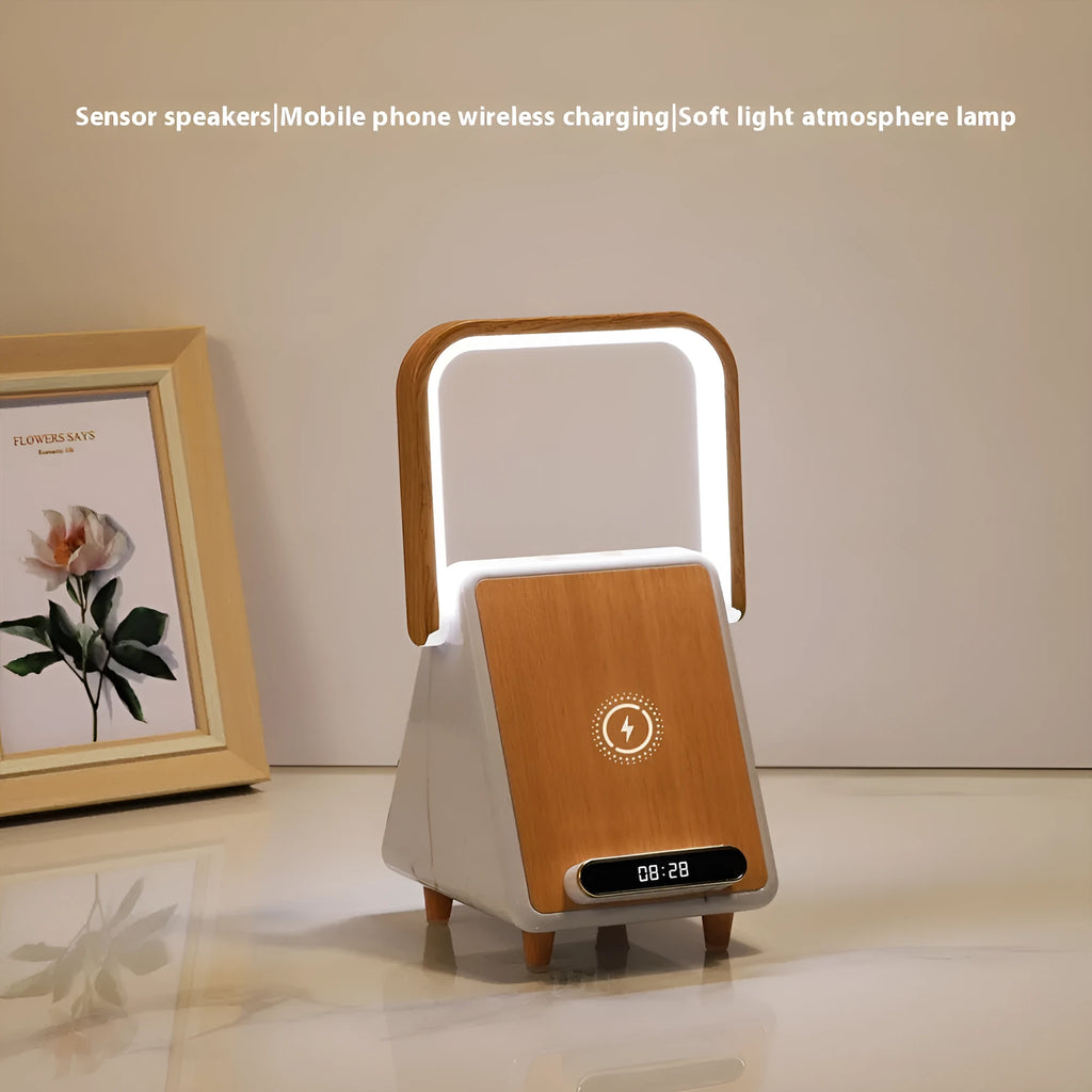 Wireless charging induction Bluetooth speaker small night lamp in Platinum Jazz finish on a wooden surface.