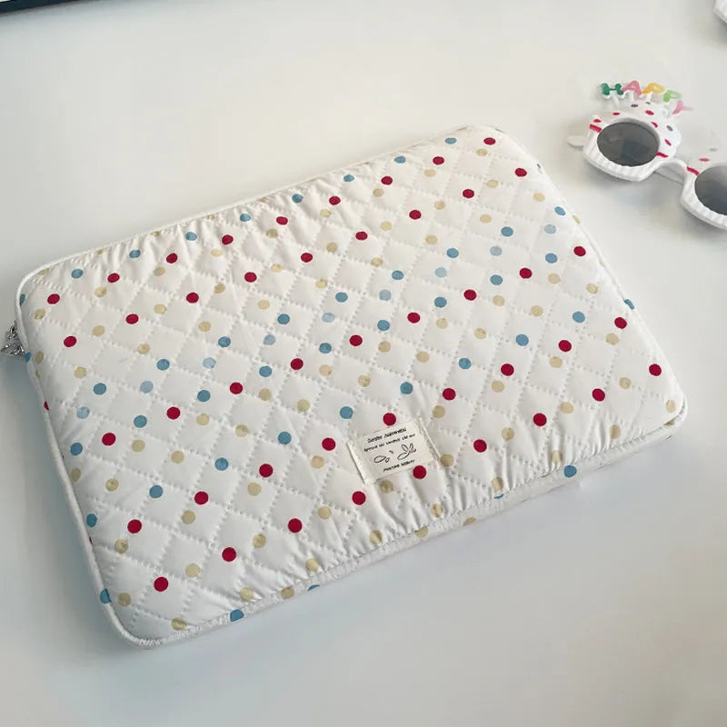 Polka dot patterned laptop bag for women, shown in available sizes for 11-inch to 15.6-inch laptops.