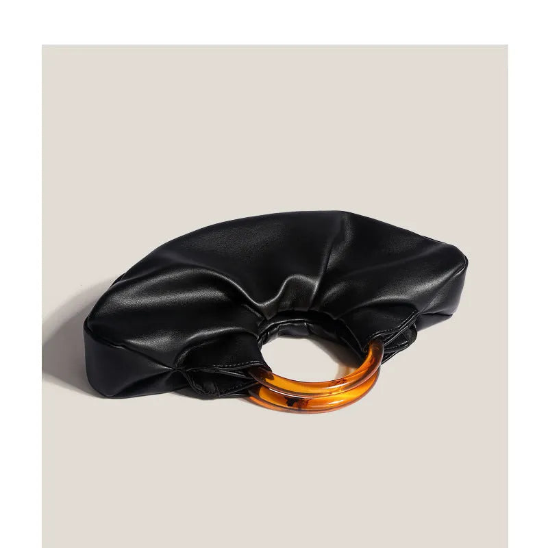 Niche Horn Bag acrylic ring handbag in black PU leather with fold design detail